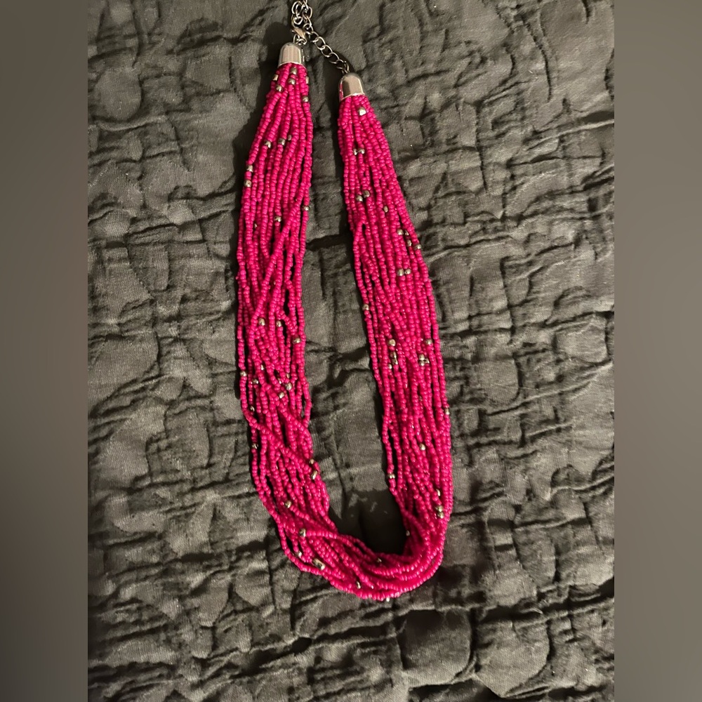 Handmade new Hot pink beaded necklace with silver accents. Lays delicately !!